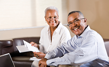 Photo of a couple smiling. Link to Life Stage Gift Planner Under Age 60 Situations.